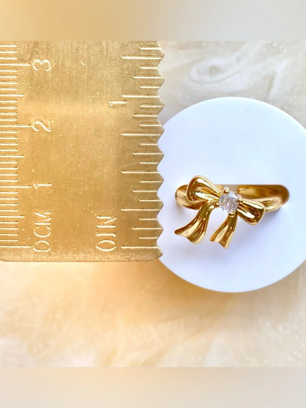 Gold Bow Ring with Clear Stone Accent